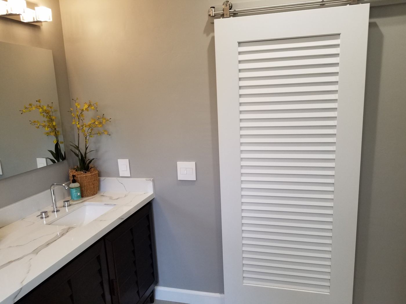 Sliding barn door and quartz vanity