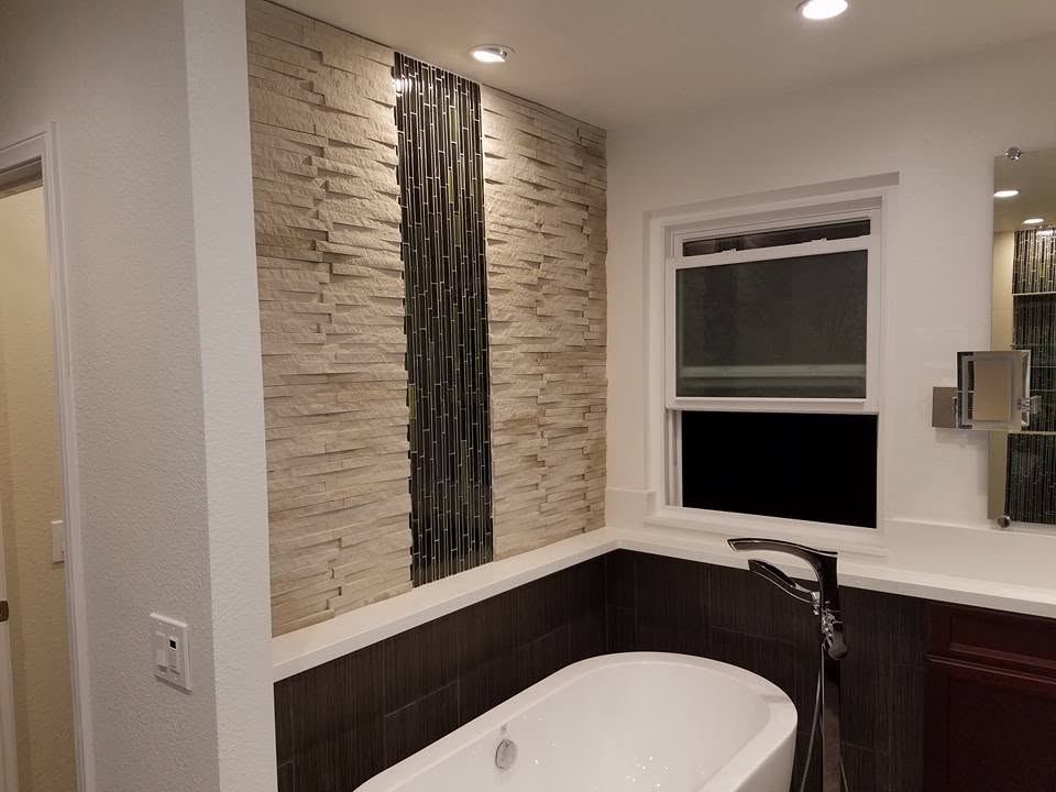 Stacked-stone accent wall with a glass mosaic inlay